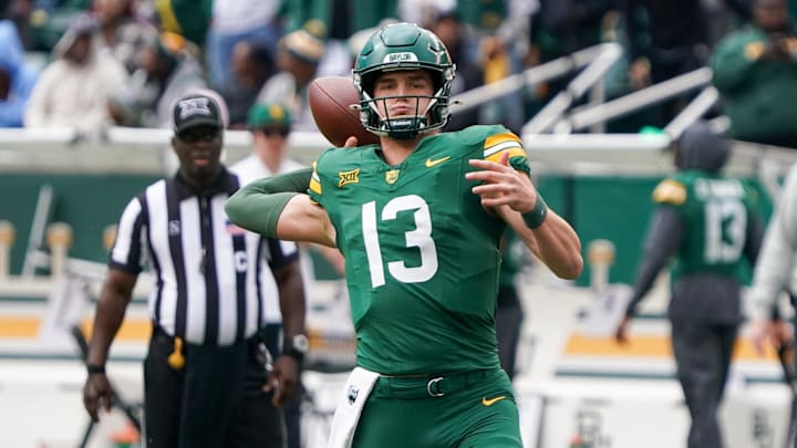 Nov 1, 2025; Waco, Texas, USA; Baylor Bears quarterback Sawyer Robertson (13) throws downfield against the UCF Knights during the first half at McLane Stadium. Mandatory Credit: Raymond Carlin III-Imagn Images Nov 1, 2025; Waco, Texas, USA; Baylor Bears quarterback Sawyer Robertson (13) throws downfield against the UCF Knights during the first half at McLane Stadium. Mandatory Credit: Raymond Carlin III-Imagn Images