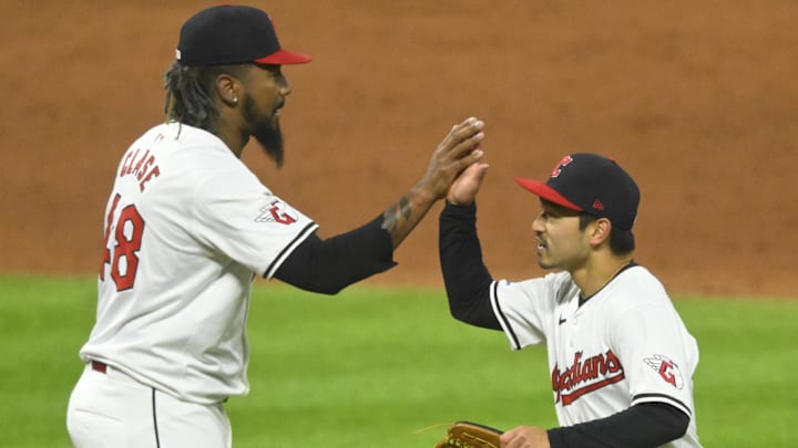 Apr 20, 2024; Cleveland, Ohio, USA; Cleveland Guardians relief pitcher Emmanuel Clase (48) and left fielder Steven Kwan (38) celebrate a win over the Oakland Athletics at Progressive Field