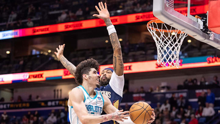 Jan 17, 2024; New Orleans, Louisiana, USA;  Charlotte Hornets guard LaMelo Ball (1) drives to the basket against New Orleans Pelicans forward Brandon Ingram (14) during the second half at Smoothie King Center. Mandatory Credit: Stephen Lew-Imagn Images