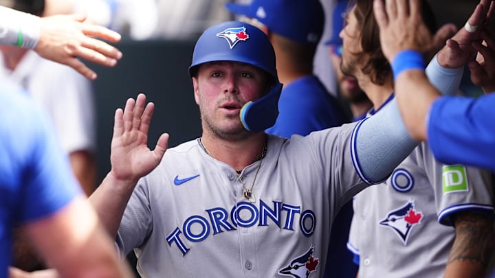 Denver, Colorado, USA; Toronto Blue Jays first baseman Ty France (2) celebrates scoring during the sixth inning against the Colorado Rockies at Coors Field.