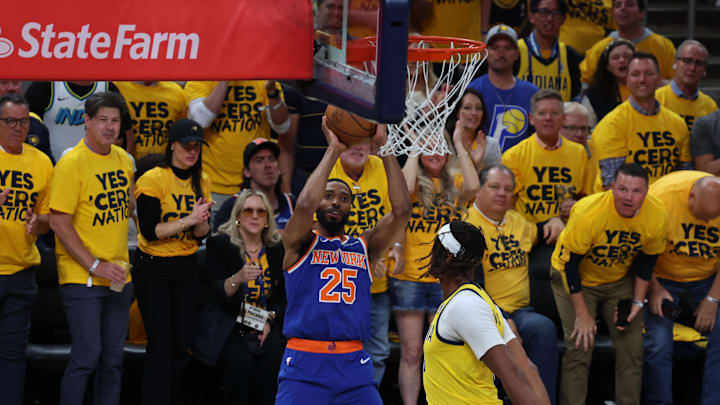 May 27, 2025; Indianapolis, Indiana, USA; New York Knicks forward Mikal Bridges (25) shoots a layup over Indiana Pacers center Myles Turner (33) during the first quarter of game four of the eastern conference finals for the 2025 NBA Playoffs at Gainbridge Fieldhouse. Mandatory Credit: Trevor Ruszkowski-Imagn Images