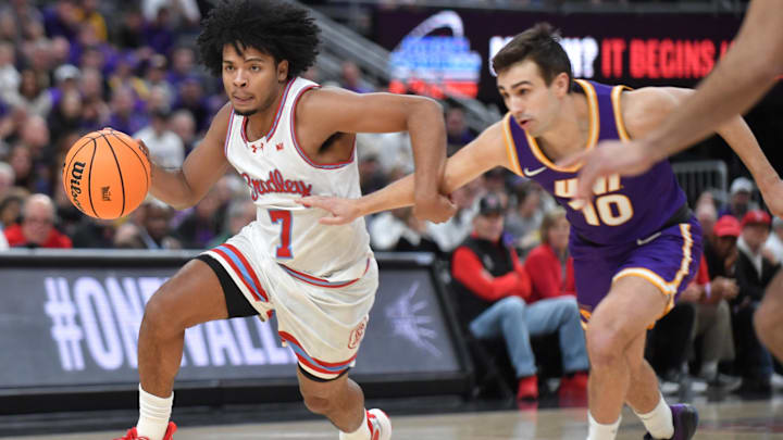 Mar 7, 2026; St. Louis, MO, USA;  Bradley Braves guard Montana Wheeler (7) drives the ball past Northern Iowa Panthers guard RJ Taylor (10) during the first half at Enterprise Center. Mandatory Credit: Ron Johnson-Imagn Images