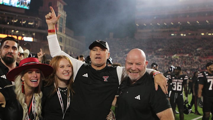 Sep 28, 2024; Lubbock, Texas, USA;  Texas Tech Red Raiders head coach Joey McGuire and associate head coach Kenny Perry after the game against the Cincinnati Bearcats at Jones AT&T Stadium and Cody Campbell Field. Mandatory Credit: Michael C. Johnson-Imagn Images