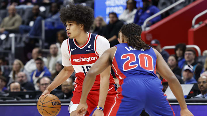 Nov 10, 2025; Detroit, Michigan, USA;  Washington Wizards forward Kyshawn George (18) dribbles defended by Detroit Pistons guard Chaz Lanier (20) in the first half at Little Caesars Arena. Mandatory Credit: Rick Osentoski-Imagn Images
