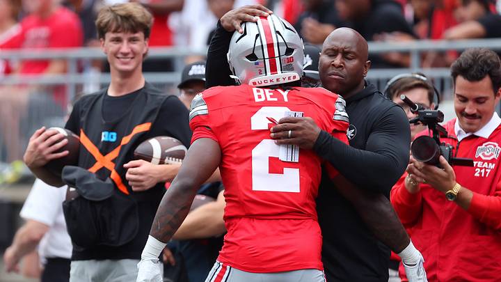 Sep 5, 2026; Columbus, Ohio, USA; Ohio State Buckeyes running back Legend Bey (2) celebrates a touchdown with running back coach Carlos Locklyn during the fourth quarter against the Ball State Cardinals at Ohio Stadium. Mandatory Credit: Joseph Maiorana-Imagn Images Sep 5, 2026; Columbus, Ohio, USA; Ohio State Buckeyes running back Legend Bey (2) celebrates a touchdown with running back coach Carlos Locklyn during the fourth quarter against the Ball State Cardinals at Ohio Stadium. Mandatory Credit: Joseph Maiorana-Imagn Images