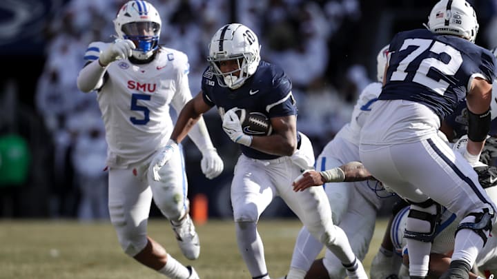 Penn State Nittany Lions running back Nicholas Singleton runs with the ball during the second quarter against the SMU Mustangs in the first round of the College Football Playoff at Beaver Stadium. Penn State Nittany Lions running back Nicholas Singleton runs with the ball during the second quarter against the SMU Mustangs in the first round of the College Football Playoff at Beaver Stadium.
