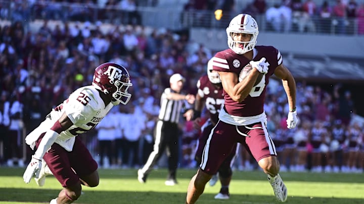 Oct 19, 2024; Starkville, Mississippi, USA; Mississippi State Bulldogs tight end Seydou Traore (18) runs the ball after a reception against Texas A&M Aggies defensive back Dalton Brooks (25) during the second quarter at Davis Wade Stadium at Scott Field. Mandatory Credit: Matt Bush-Imagn Images