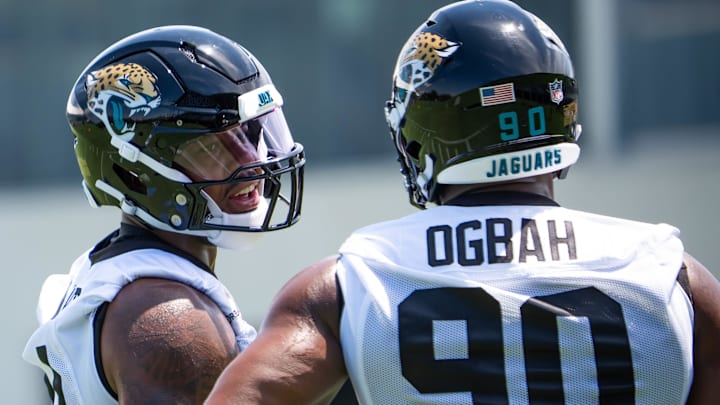 Jacksonville Jaguars defensive end Travon Walker (44) talks with Jacksonville Jaguars defensive lineman Emmanuel Ogbah (90) during the fourth organized team activity at the Miller Electric Center in Jacksonville, Fla. Tuesday, May 27, 2025. [Doug Engle/Florida Times-Union]