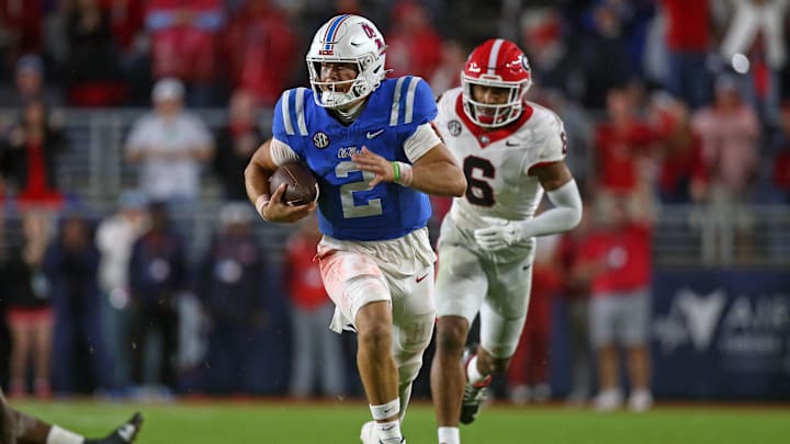 Nov 9, 2024; Oxford, Mississippi, USA; Mississippi Rebels quarterback Jaxson Dart (2) runs the ball during the second half  against the Georgia Bulldogs at Vaught-Hemingway Stadium. Mandatory Credit: Petre Thomas-Imagn Images