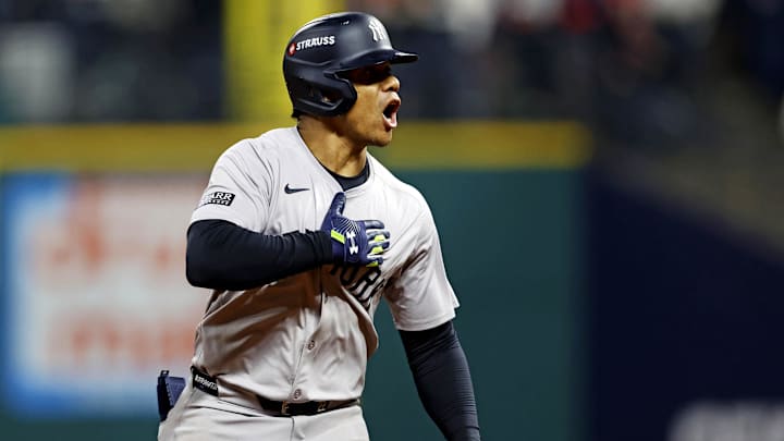 Oct 19, 2024; Cleveland, Ohio, USA; New York Yankees outfielder Juan Soto (22) celebrates while running the bases after hitting a three run home run during the tenth inning against the Cleveland Guardians during game five of the ALCS for the 2024 MLB playoffs at Progressive Field. Mandatory Credit: Scott Galvin-Imagn Images