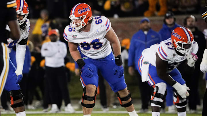 Nov 18, 2023; Columbia, Missouri, USA; Florida Gators offensive lineman Jake Slaughter (66) at the line of scrimmage against the Missouri Tigers during the game at Faurot Field at Memorial Stadium. Mandatory Credit: Denny Medley-Imagn Images