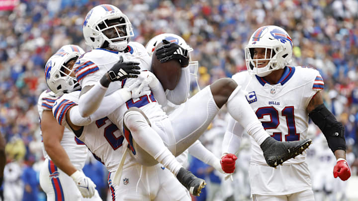 Sep 24, 2023; Landover, Maryland, USA; Buffalo Bills cornerback Tre'Davious White (27) celebrates with Bills safety Micah Hyde (23) after intercepting a pass in the end zone against the Washington Commanders during the third quarter at FedExField. Mandatory Credit: Geoff Burke-Imagn Images