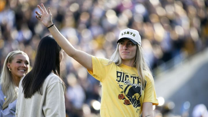 Iowa women’s basketball alumni Kate Martin waves to the crowd during an Iowa football game against Northwestern Saturday, Oct. 26, 2024 at Kinnick Stadium in Iowa City, Iowa.