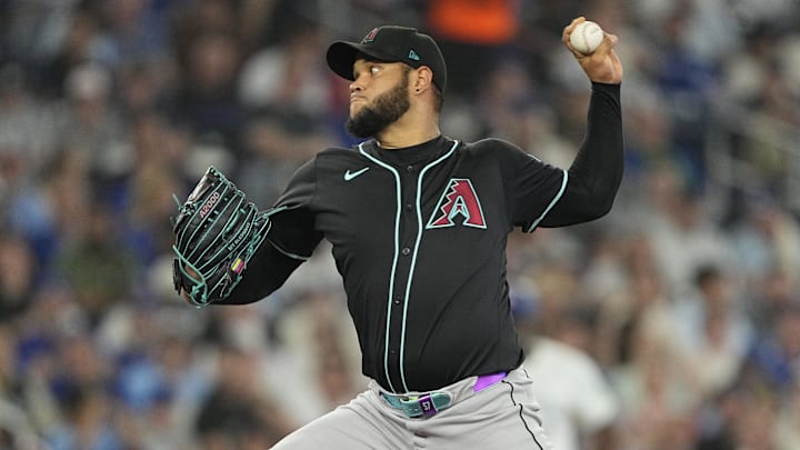 Jun 18, 2025; Toronto, Ontario, CAN; Arizona Diamondbacks starting pitcher Eduardo Rodriguez (57) pitches to the Toronto Blue Jays during the fourth inning at Rogers Centre. Mandatory Credit: John E. Sokolowski-Imagn Images Jun 18, 2025; Toronto, Ontario, CAN; Arizona Diamondbacks starting pitcher Eduardo Rodriguez (57) pitches to the Toronto Blue Jays during the fourth inning at Rogers Centre. Mandatory Credit: John E. Sokolowski-Imagn Images