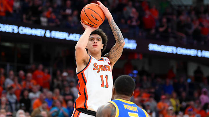 Mar 7, 2026; Syracuse, New York, USA; Syracuse Orange guard Naithan George (11) shoots against Pittsburgh Panthers guard Damarco Minor (7) during the second half at the JMA Wireless Dome. Mandatory Credit: Rich Barnes-Imagn Images