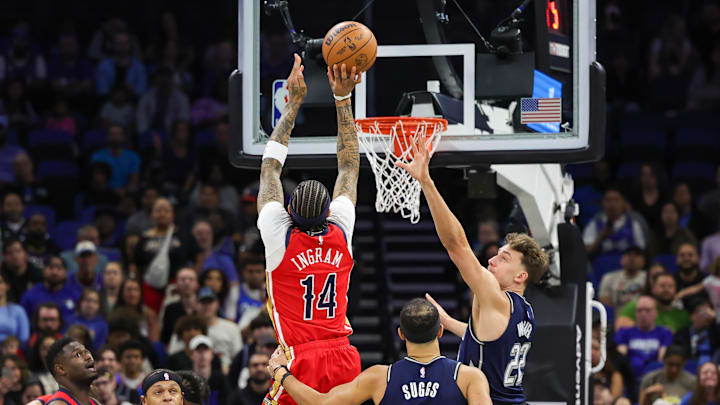 New Orleans Pelicans forward Brandon Ingram (14) shoots the ball against Orlando Magic forward Franz Wagner (22) during the first quarter at KIA Center. New Orleans Pelicans forward Brandon Ingram (14) shoots the ball against Orlando Magic forward Franz Wagner (22) during the first quarter at KIA Center.