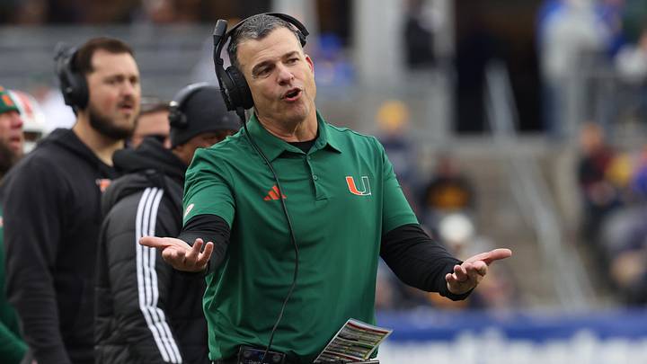 Nov 29, 2025; Pittsburgh, Pennsylvania, USA;  Miami Hurricanes head coach Mario Cristobal reacts on the sidelines against the Pittsburgh Panthers during the third quarter at Acrisure Stadium. Mandatory Credit: Charles LeClaire-Imagn Images