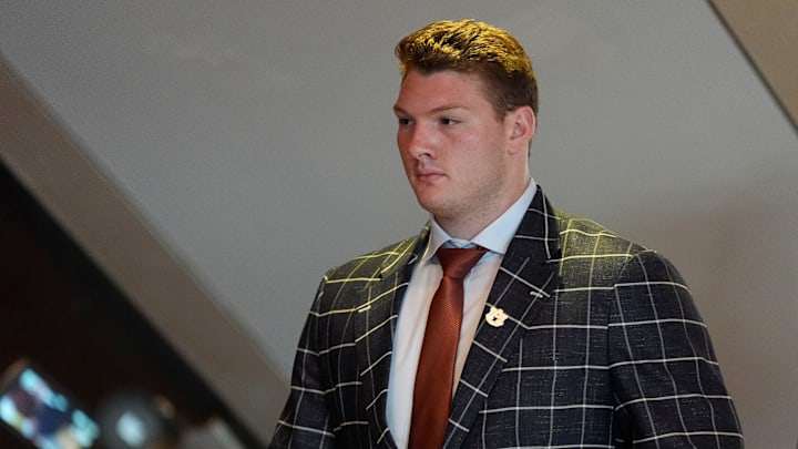 July 15, 2025; Atlanta, GA, USA; Auburn’s Connor Lew goes to an interview during SEC Media Days at the College Football Hall of Fame in Atlanta.