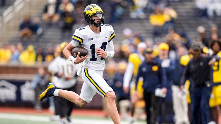 Michigan quarterback Tommy Carr (14) runs the ball during the spring game at Michigan Stadium in Ann Arbor on Saturday, April 18, 2026.
