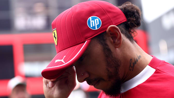 Lewis Hamilton of Scuderia Ferrari looks dejected at the end...