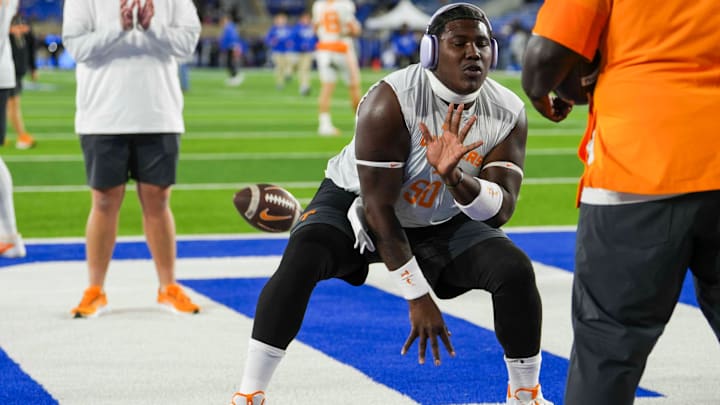 Tennessee offensive lineman William Satterwhite (50) snaps the ball during warm-ups for a NCAA football game against Kentucky at Kroger Field in Lexington, Kentucky on Oct. 25, 2025.