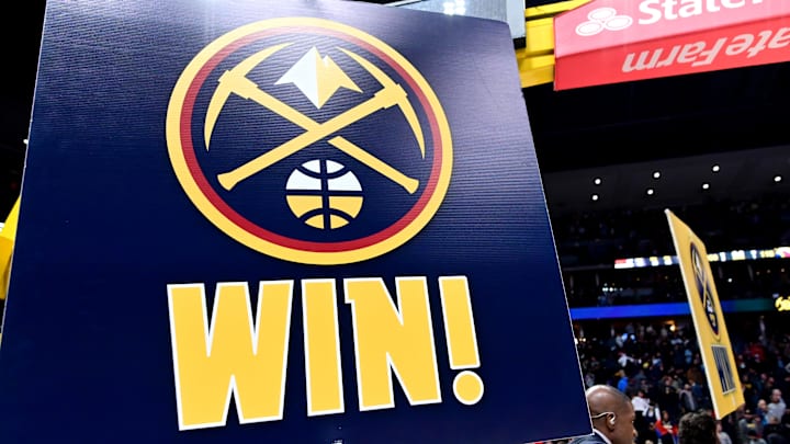 Feb 15, 2023; Denver, Colorado, USA; Denver Nuggets floor staff celebrates the win over the Dallas Mavericks at Ball Arena. Mandatory Credit: Ron Chenoy-Imagn Images