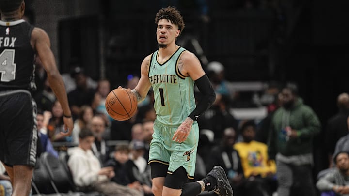 Feb 7, 2025; Charlotte, North Carolina, USA;Charlotte Hornets guard LaMelo Ball (1) brings the ball up court against the San Antonio Spurs  during the first quarter at Spectrum Center. Mandatory Credit: Jim Dedmon-Imagn Images