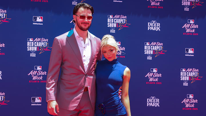 Jul 15, 2025; Atlanta, GA, USA; National League pitcher Paul Skenes (30) of the Pittsburgh Pirates and social media influencer Livvy Dunne pose for a photo on the red carpet before the 2025 MLB All Star Game at Truist Park. Mandatory Credit: Brett Davis-Imagn Images