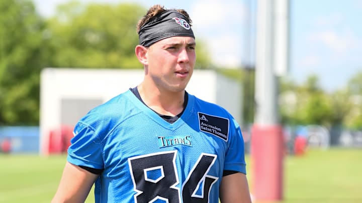 Jul 23, 2025; Nashville, TN, USA;  Tennessee Titans tight end Gunnar Helm (84) walks off the field during training camp at Ascension Saint Thomas Sports Park. Mandatory Credit: Steve Roberts-Imagn Images