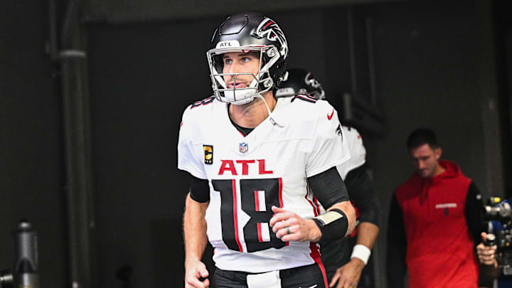 Dec 8, 2024; Minneapolis, Minnesota, USA; Atlanta Falcons quarterback Kirk Cousins (18) enters the field before the game against the Minnesota Vikings at U.S. Bank Stadium.