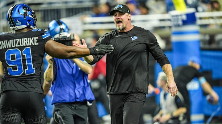 Detroit Lions head coach Dan Campbell greets players during warmups at Ford Field in Detroit on Sunday, Dec. 15, 2024.