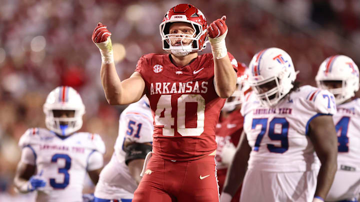 Nov 23, 2024; Fayetteville, Arkansas, USA; Arkansas Razorbacks defensive lineman Landon Jackson (40) celebrates after sacking Louisiana Tech Bulldogs quarterback Evan Bullock (7) during the fourth quarter at Donald W. Reynolds Razorback Stadium. Arkansas won 35-14. Mandatory Credit: Nelson Chenault-Imagn Images