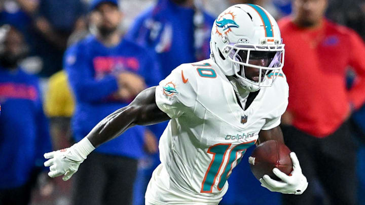 Sep 18, 2025; Orchard Park, New York, USA; Miami Dolphins wide receiver Tyreek Hill (10) runs after making a catch against the Buffalo Bills in the second quarter at Highmark Stadium. Mandatory Credit: Mark Konezny-Imagn Images