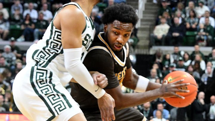 Dec 30, 2024; East Lansing, Michigan, USA; Western Michigan Broncos guard Chansey Willis Jr. (2) gets trapped by Michigan State Spartans guard Jaden Akins (3) during the first half  at Jack Breslin Student Events Center. Mandatory Credit: Dale Young-Imagn Images