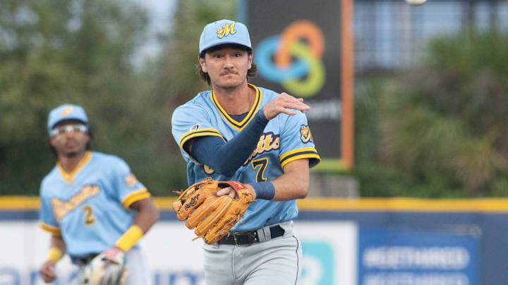 Second baseman Alika Williams (7) throws to first for an out during the Montgomery Biscuits vs