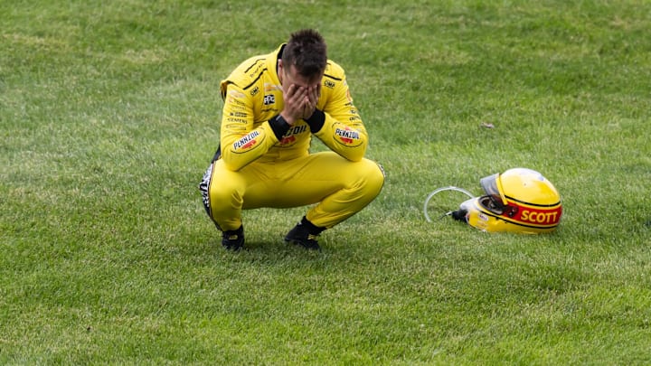 Scott McLaughlin reacts after crashing on the pace lap of the Indy 500.