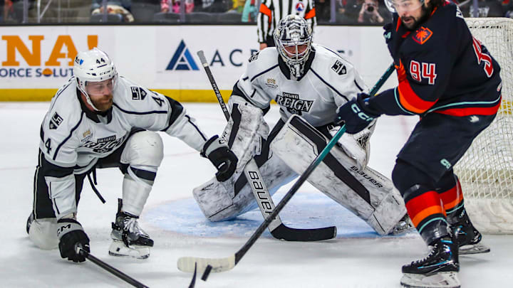 Coachella Valley forward Devin Shore (94) passes the puck away from Ontario defenseman Kevin Connauton (44) to try to set up a teammate with a shot as goaltender Erik Portillo (1) looks on during the first period of Game 2 of the Pacific Division Finals at Acrisure Arena in Palm Desert, Calif., Friday, May 17, 2024.