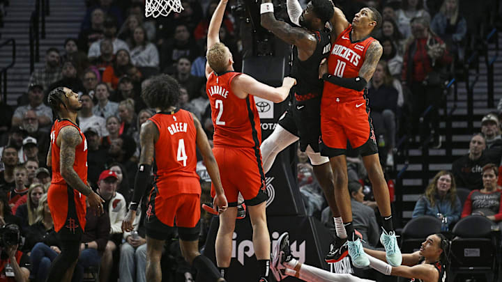 Apr 12, 2024; Portland, Oregon, USA; Portland Trail Blazers center Deandre Ayton (2) drives to the basket during the first half against Houston Rockets forward Jabari Smith Jr. (10) and center Jock Landale (2) at Moda Center. Mandatory Credit: Troy Wayrynen-USA TODAY Sports