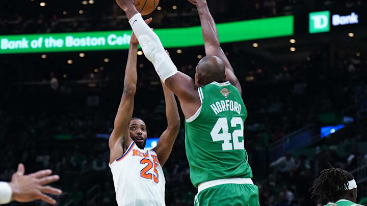 Oct 22, 2024; Boston, Massachusetts, USA; New York Knicks forward Mikal Bridges (25) shoots against Boston Celtics center Al Horford (42) in the second half at TD Garden. Mandatory Credit: David Butler II-Imagn Images