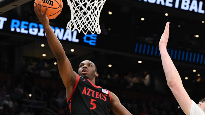 Mar 28, 2024; Boston, MA, USA; San Diego State Aztecs guard Lamont Butler (5) shoots the ball against the Connecticut Huskies in the semifinals of the East Regional of the 2024 NCAA Tournament at TD Garden. Mandatory Credit: Brian Fluharty-USA TODAY Sports