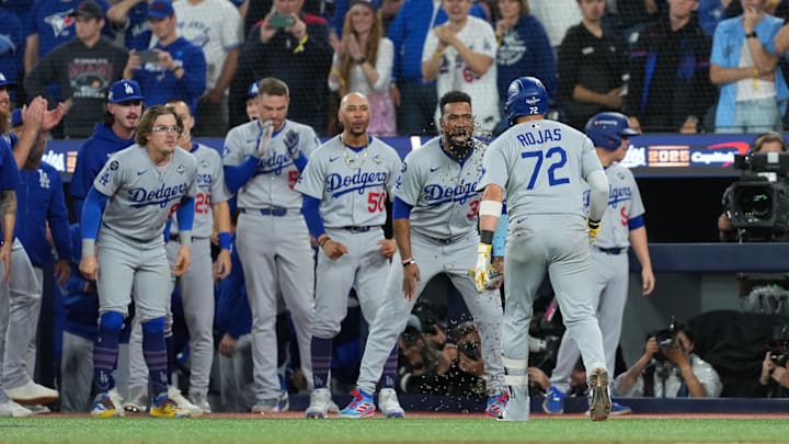 Nov 1, 2025; Toronto, Ontario, CAN; Los Angeles Dodgers second baseman Miguel Rojas (72) reacts after hitting a home run against the Toronto Blue Jays in the ninth inning for game seven of the 2025 MLB World Series at Rogers Centre. Mandatory Credit: Nick Turchiaro-Imagn Images