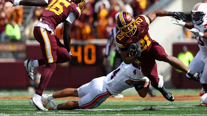 Sep 6, 2025; Minneapolis, Minnesota, USA; Minnesota Golden Gophers running back Grant Washington (21) runs the ball against the Northwestern State Demons during the third quarter at Huntington Bank Stadium. Mandatory Credit: Matt Krohn-Imagn Images