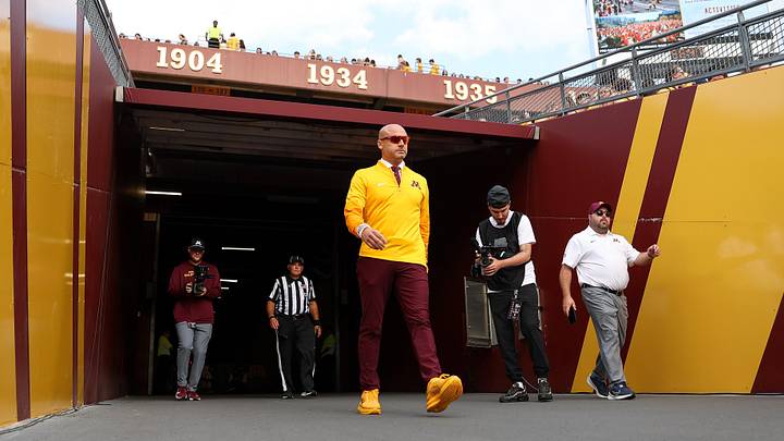 Aug 28, 2025; Minneapolis, Minnesota, USA; Minnesota Golden Gophers head coach P.J. Fleck walks onto the field before the game against the Buffalo Bulls at Huntington Bank Stadium. Mandatory Credit: Matt Krohn-Imagn Images