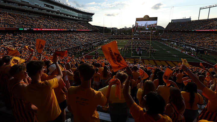 Aug 28, 2025; Minneapolis, Minnesota, USA; Minnesota Golden Gophers fans wave towels before the game against the Buffalo Bulls at Huntington Bank Stadium. Mandatory Credit: Matt Krohn-Imagn Images