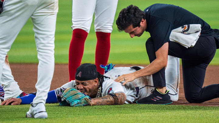 Aug 10, 2024; Phoenix, Arizona, USA; Arizona Diamondbacks infielder Ketel Marte (4) reacts after a collision with Philadelphia Phillies catcher Garrett Stubbs (21) (not shown) at second base in the fourth inning during a game against the Philadelphia Phillies at Chase Field. Mandatory Credit: Allan Henry-Imagn Images Aug 10, 2024; Phoenix, Arizona, USA; Arizona Diamondbacks infielder Ketel Marte (4) reacts after a collision with Philadelphia Phillies catcher Garrett Stubbs (21) (not shown) at second base in the fourth inning during a game against the Philadelphia Phillies at Chase Field. Mandatory Credit: Allan Henry-Imagn Images