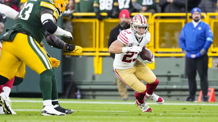 Nov 24, 2024; Green Bay, Wisconsin, USA; San Francisco 49ers running back Christian McCaffrey (23) rushes with the football during the first quarter against the Green Bay Packers at Lambeau Field. Mandatory Credit: Jeff Hanisch-Imagn Images Nov 24, 2024; Green Bay, Wisconsin, USA; San Francisco 49ers running back Christian McCaffrey (23) rushes with the football during the first quarter against the Green Bay Packers at Lambeau Field. Mandatory Credit: Jeff Hanisch-Imagn Images