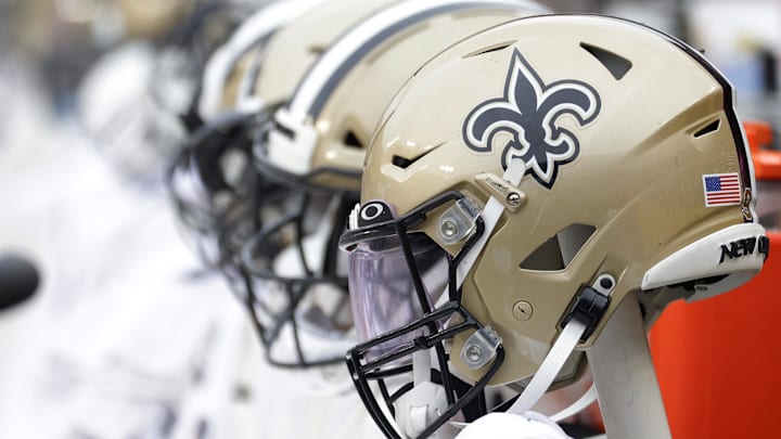 Oct 10, 2021; Landover, Maryland, USA; New Orleans Saints players' helmets on the bench against the Washington Football Team at FedExField. Mandatory Credit: Geoff Burke-Imagn Images