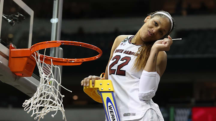 South Carolina basketball legend A'ja Wilson cutting down her piece of the net after winning the 2016-2017 National Championship