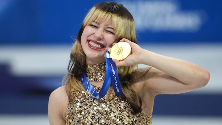 Feb 19, 2026; Milan, Italy; Alysa Liu of the United States celebrates with the gold medal in the women's free skate during the Milano Cortina 2026 Olympic Winter Games at Milano Ice Skating Arena.