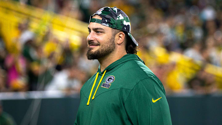 Green Bay Packers tackle David Bakhtiari smiles at fans during Packers Family Night on Aug. 5, 2022, at Lambeau Field.